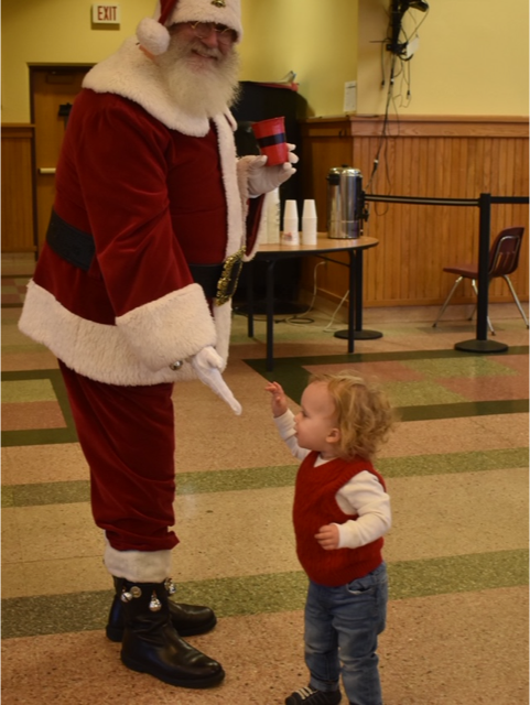 Little_One_Greets_Santa_at_Breakfast